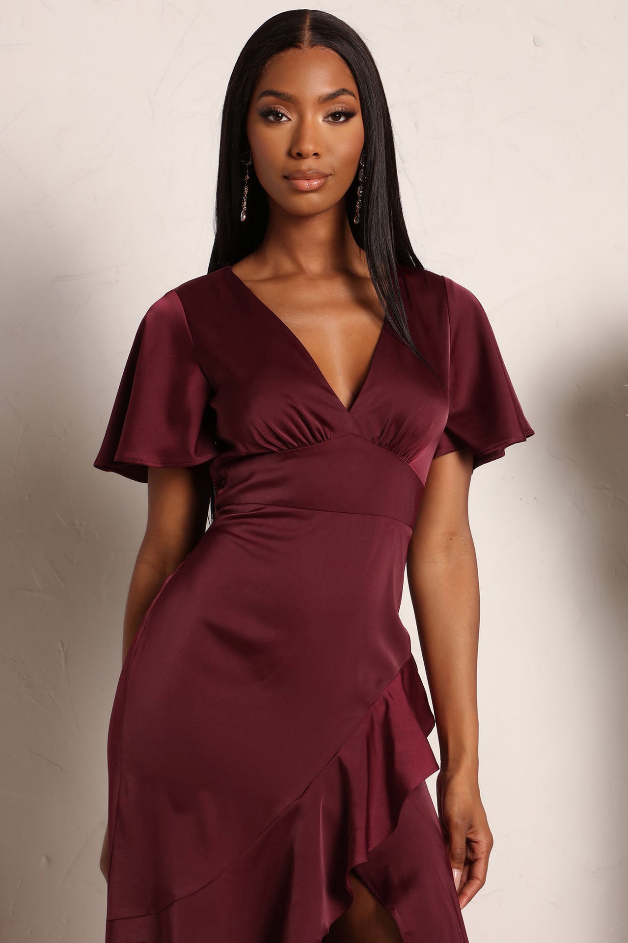 V Neck Bodycon Dress with Ruffled Asymmetrical Hem and Cinched Waist | noémi
