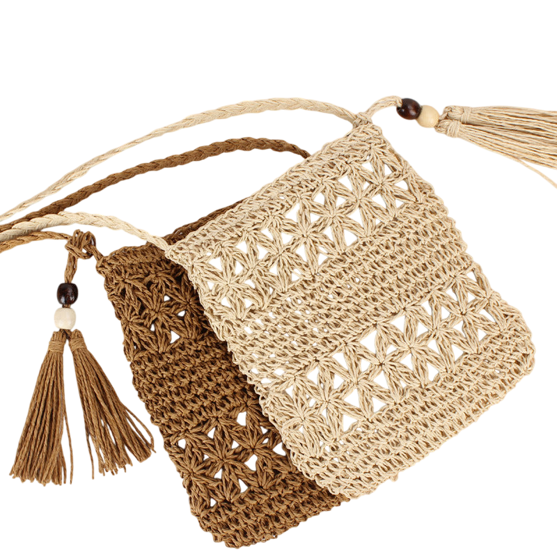 Natural Straw Hollow‑Cut Cross‑Body Bag – Tassel Accent, Hand‑Woven | noémi