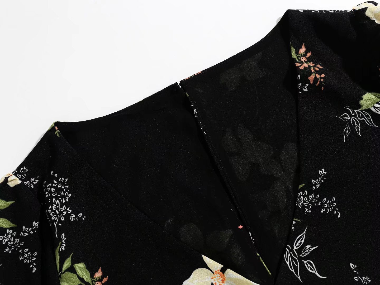 V Neck Backless Dress With Cutout Detail And Scattered Floral Ruffles | noémi