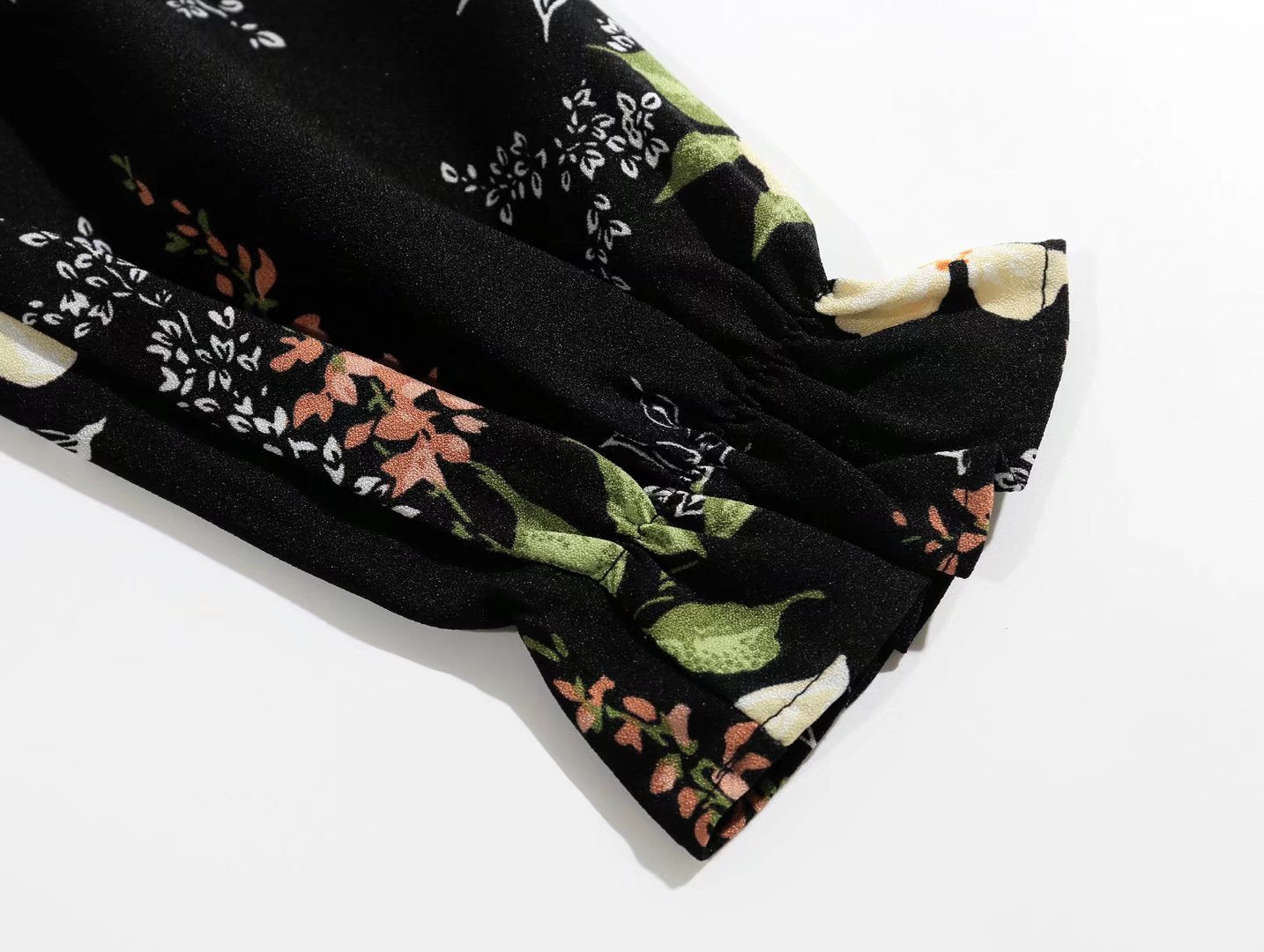 V Neck Backless Dress With Cutout Detail And Scattered Floral Ruffles | noémi