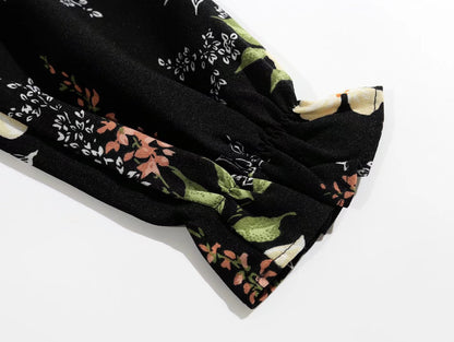 V Neck Backless Dress With Cutout Detail And Scattered Floral Ruffles | noémi