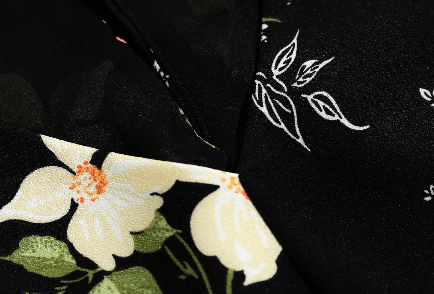 V Neck Backless Dress With Cutout Detail And Scattered Floral Ruffles | noémi