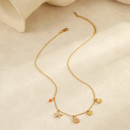 Ocean Inspired Layered Necklace | Gold Stainless Steel with Starfish, Conch & Shell Charms | noémi