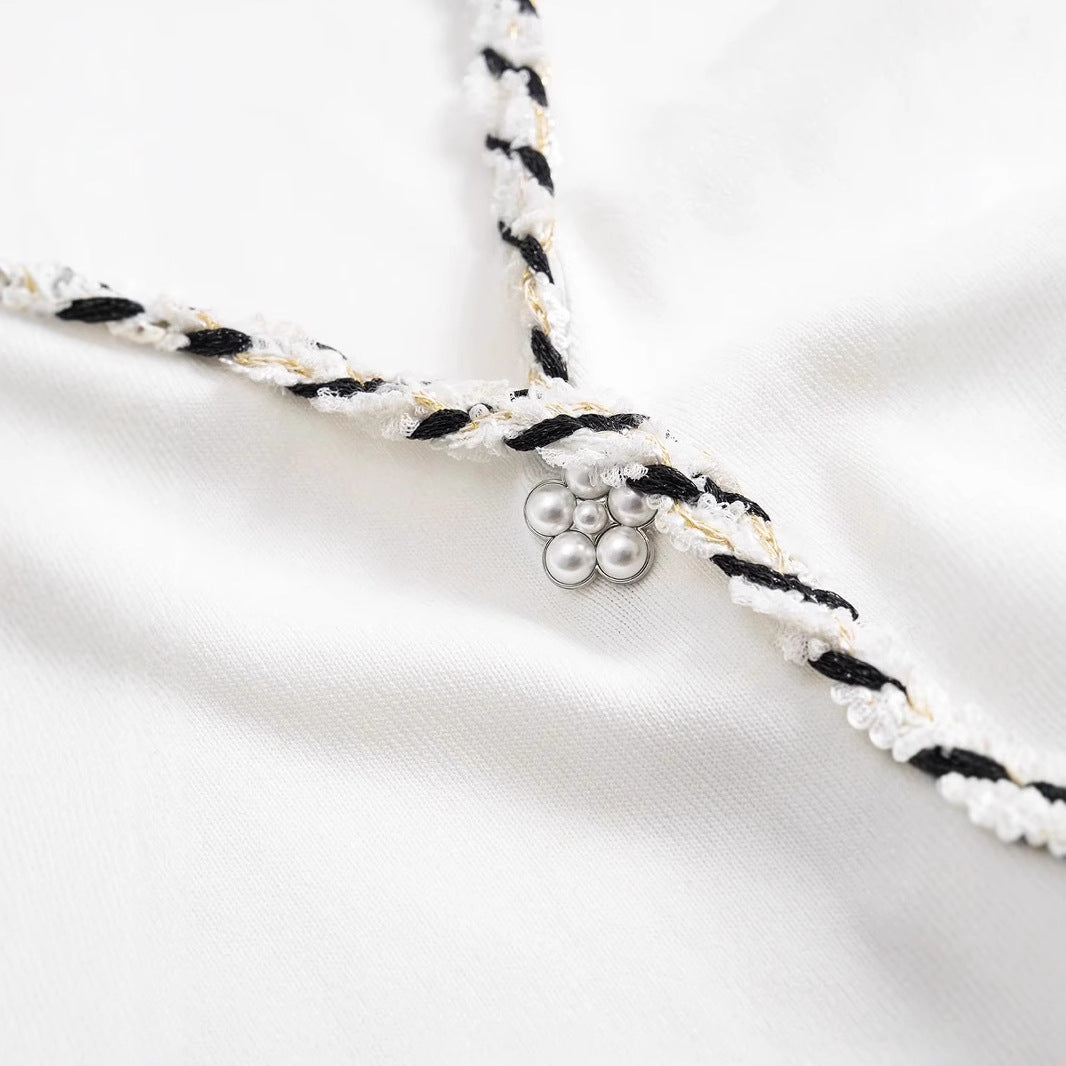 Sleeveless VNeck Tassel Hem Dress | Elegant Contrast Color Weave | noémi