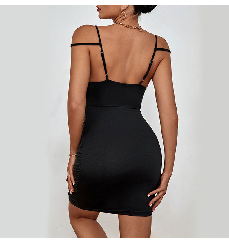 Black Sling Dress with Ruffle Hip and Cutout Detail | noémi