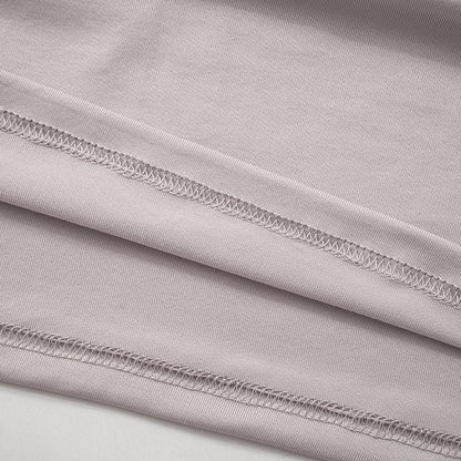 Women Long Sleeve Hooded Pleated Dress with High Waist and Hip Detail | noémi